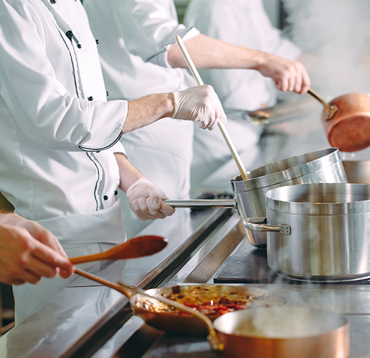 Chefs cooking in kitchen