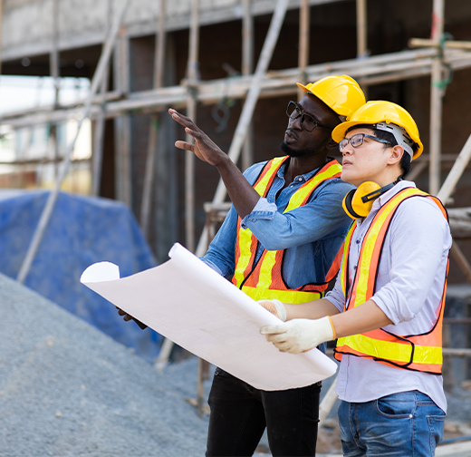Construction workers discussing building